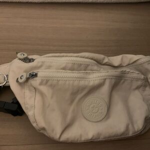 Kipling Cream Belt Bag with Zipper Closure and Logo